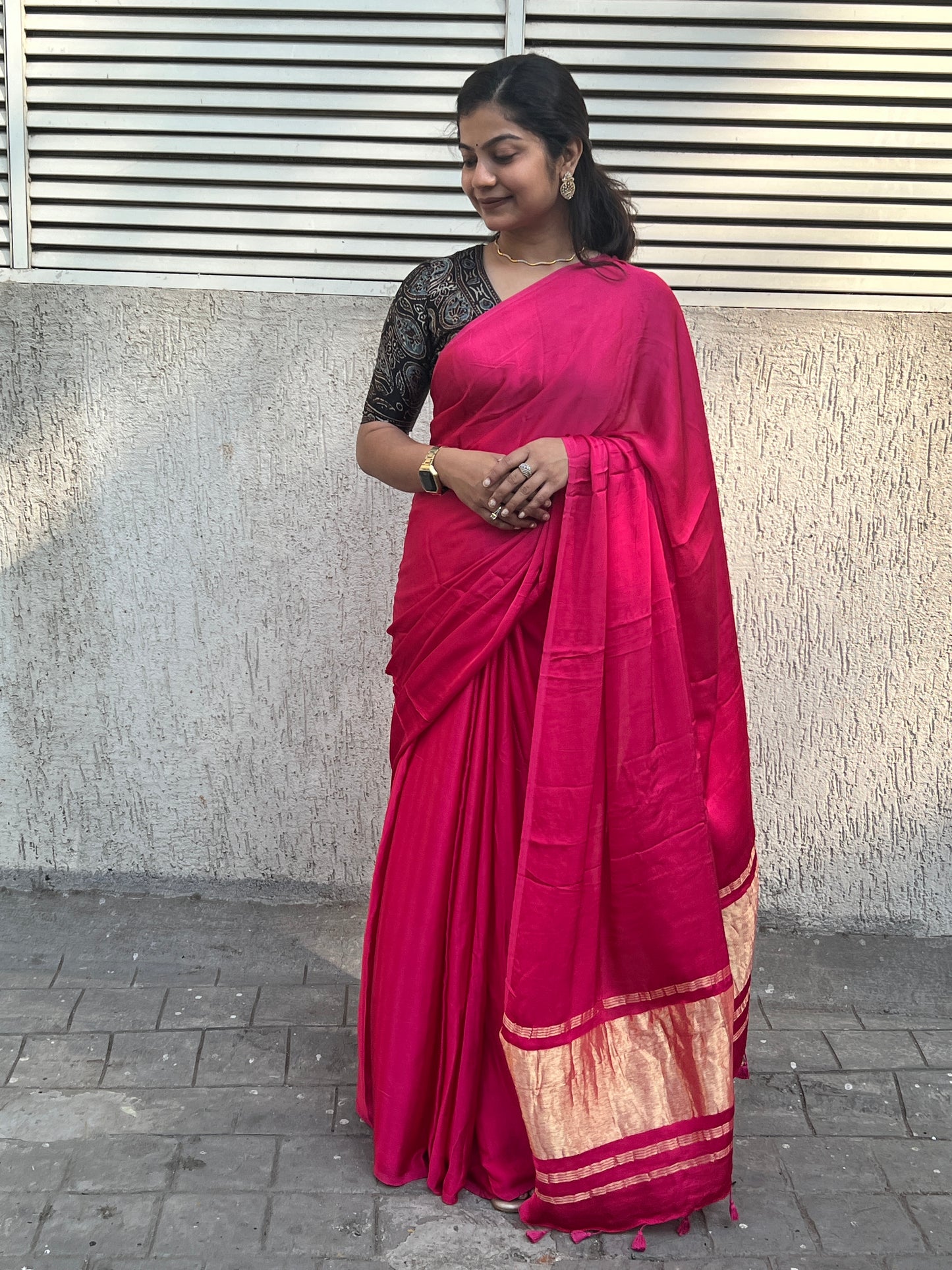 Pink plain modal silk saree with tissue border