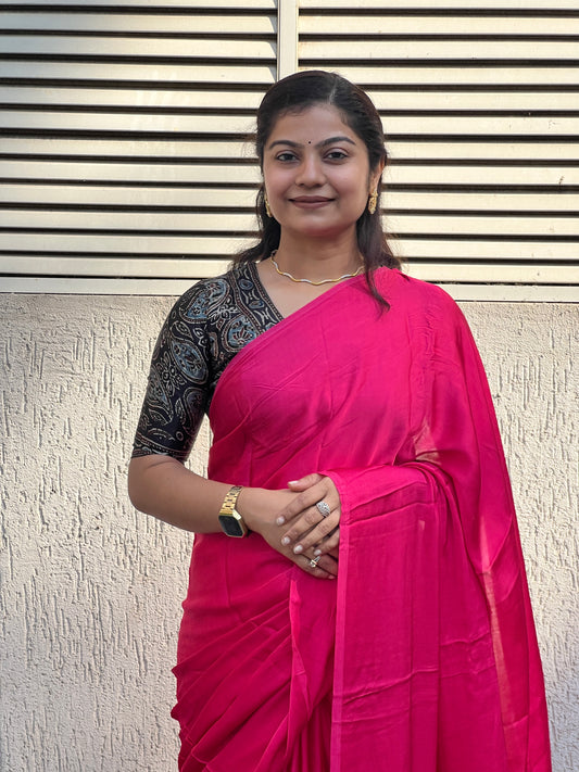 Pink plain modal silk saree with tissue border