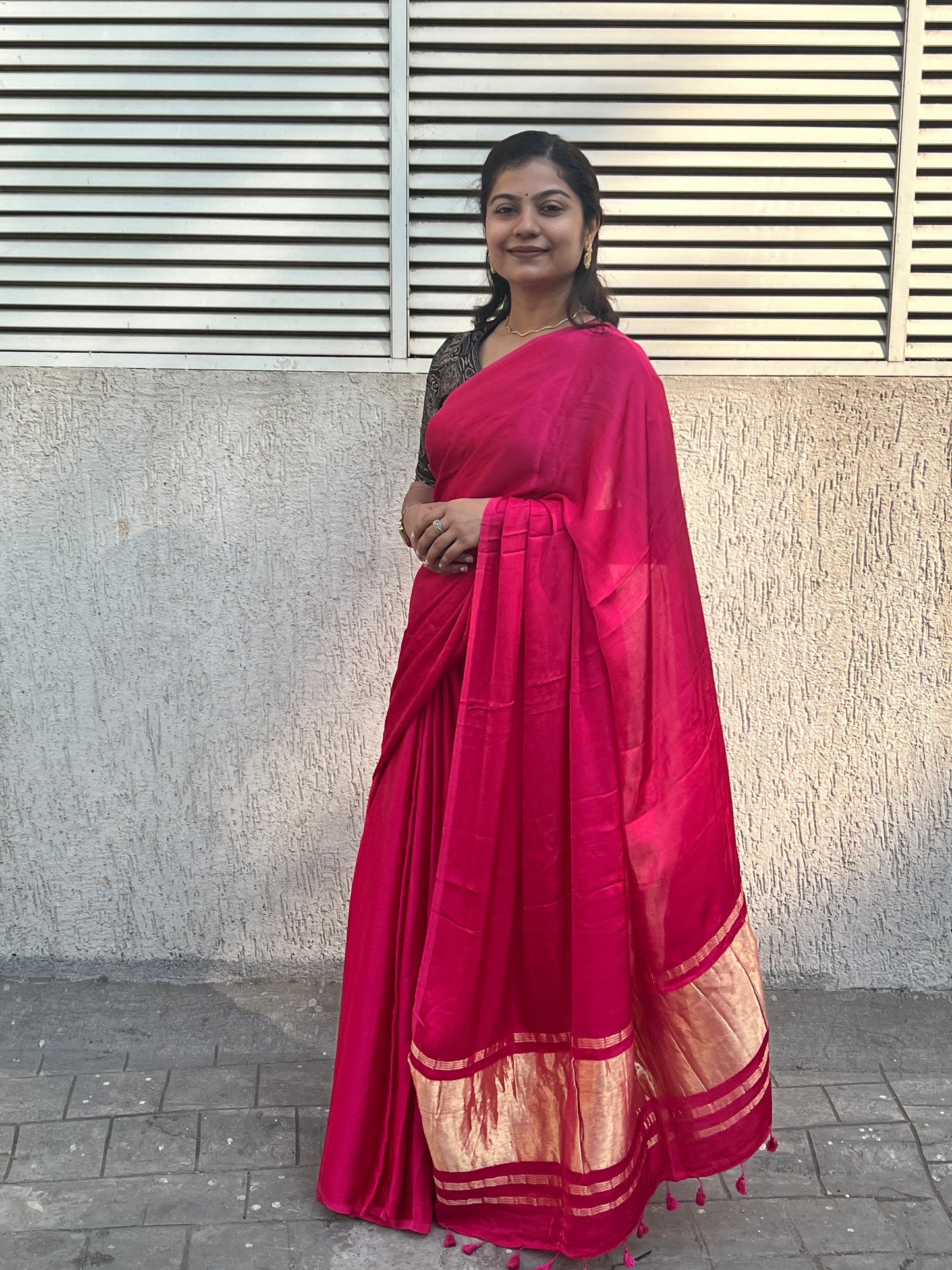Pink plain modal silk saree with tissue border